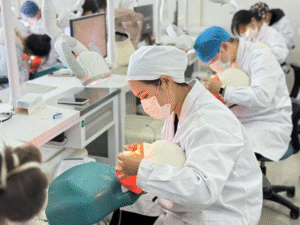 students practice dentistry skill in laboratory